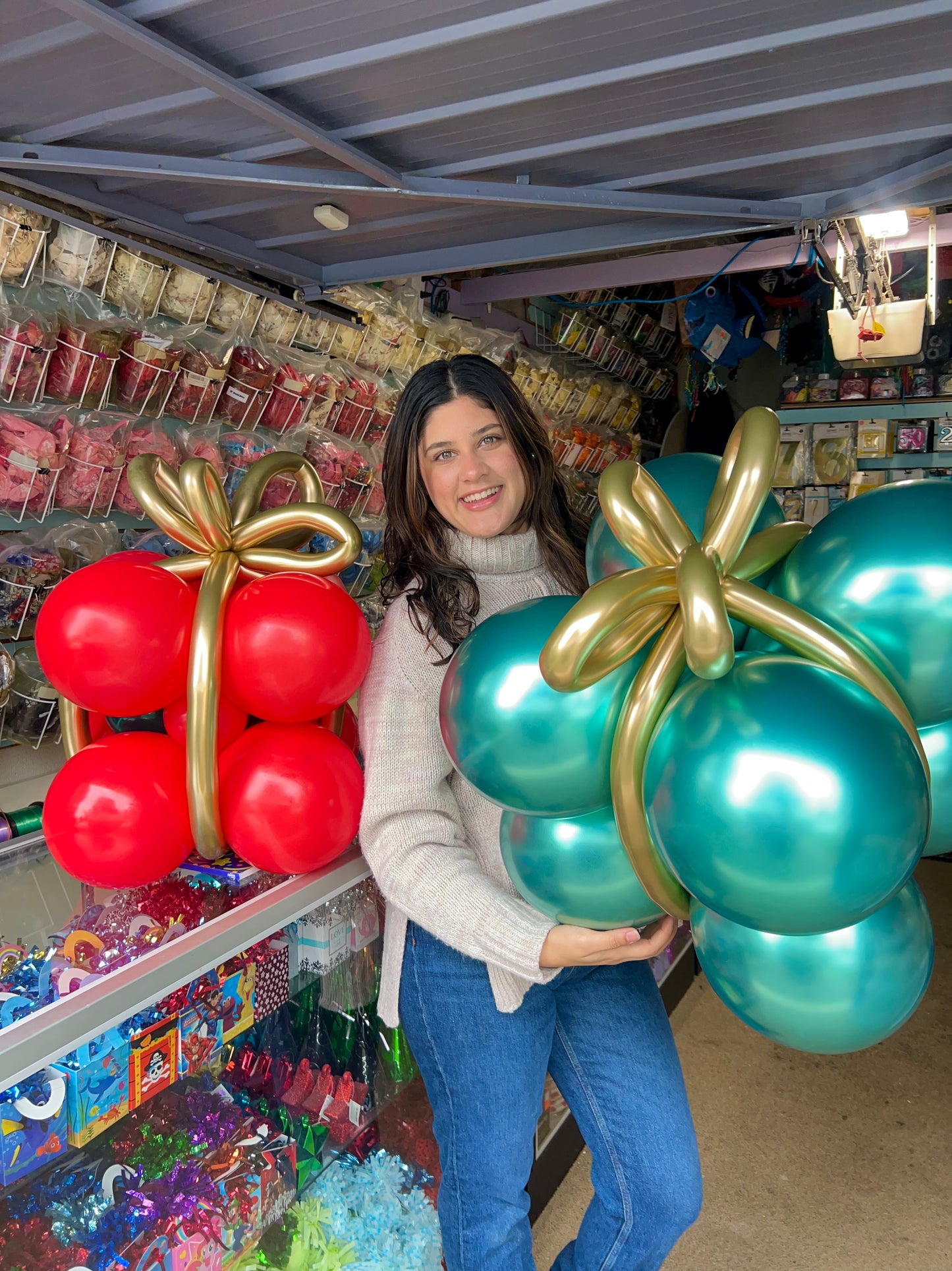 Freestanding air-filled Christmas balloon gifts with festive colors, made from biodegradable latex, lasting up to 10 days.
