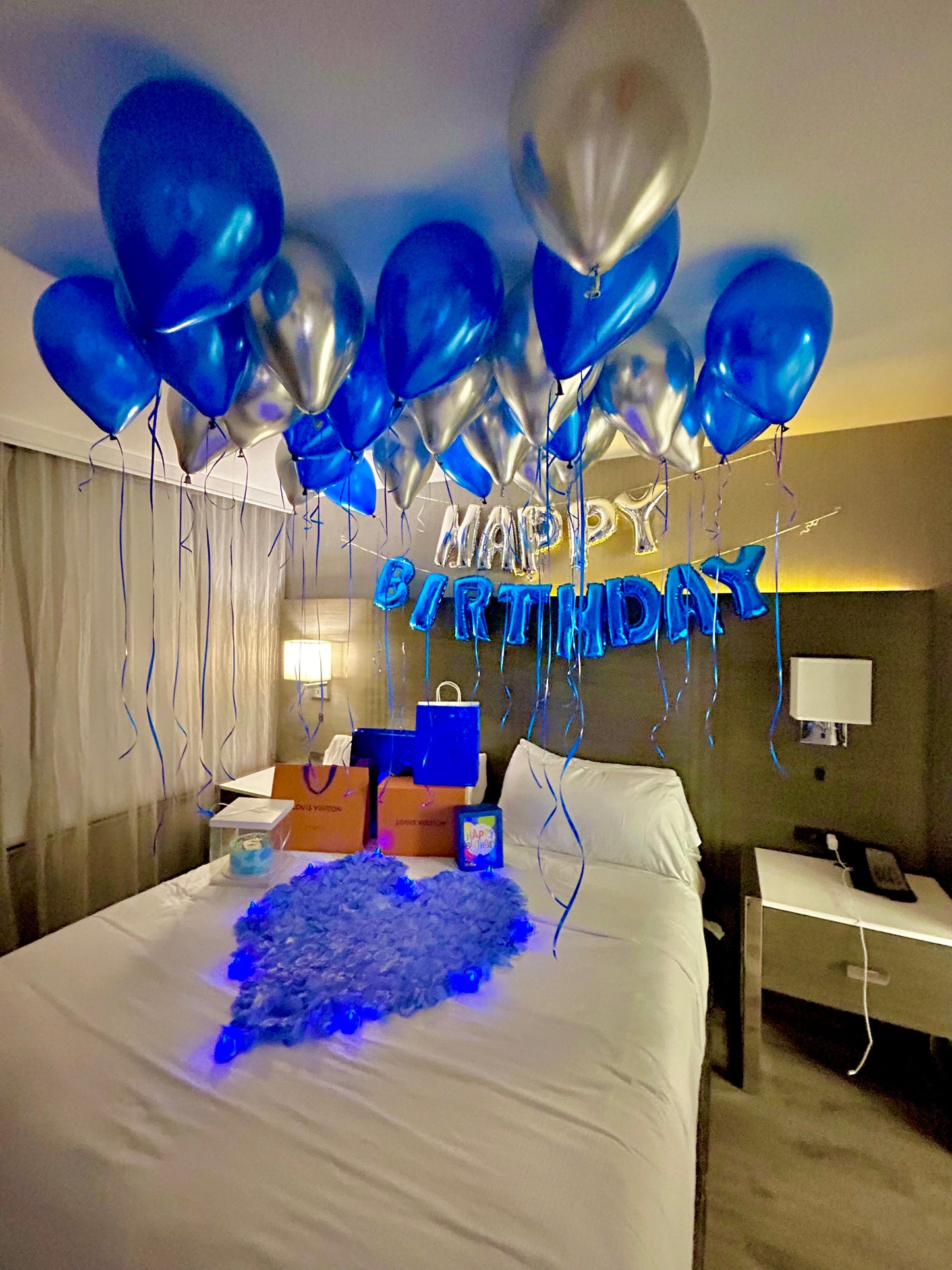 Blue & Silver Happy Birthday Balloon Decor with helium balloons, banner, and number stands.
