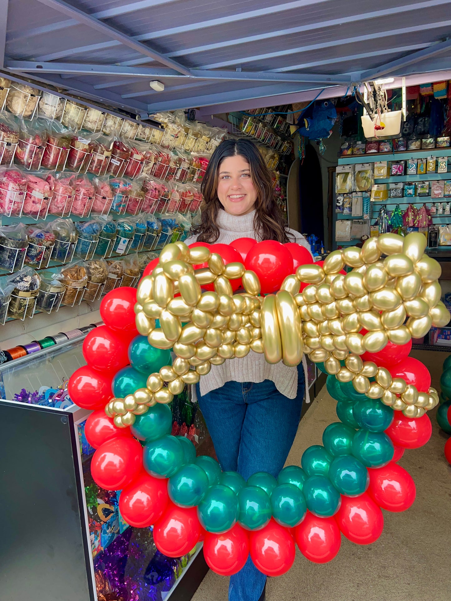 Freestanding Christmas Balloon Wreath made from biodegradable latex, perfect for holiday decoration.