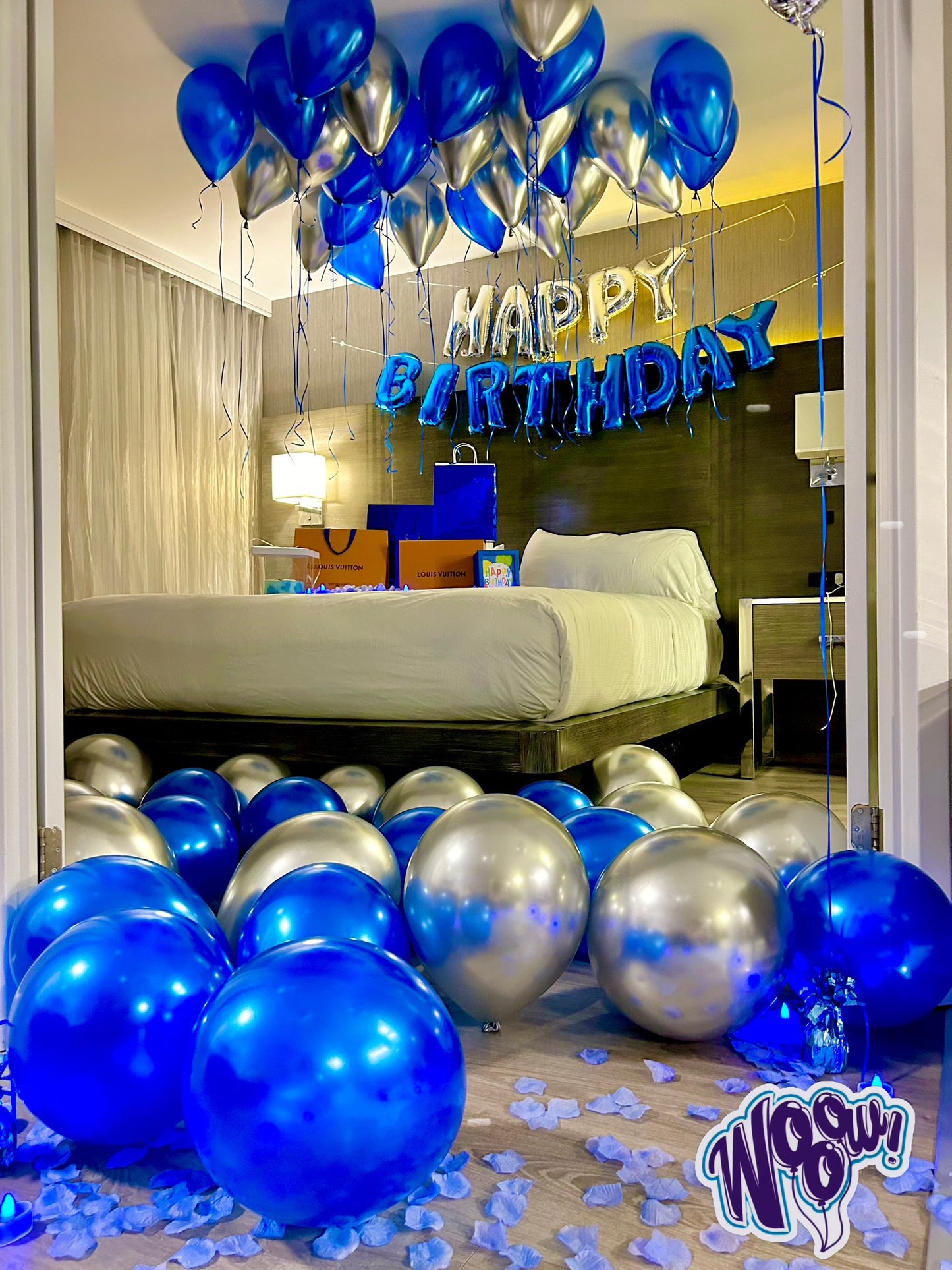 Blue & Silver Happy Birthday Balloon Decor with helium balloons, banner, and number stands.