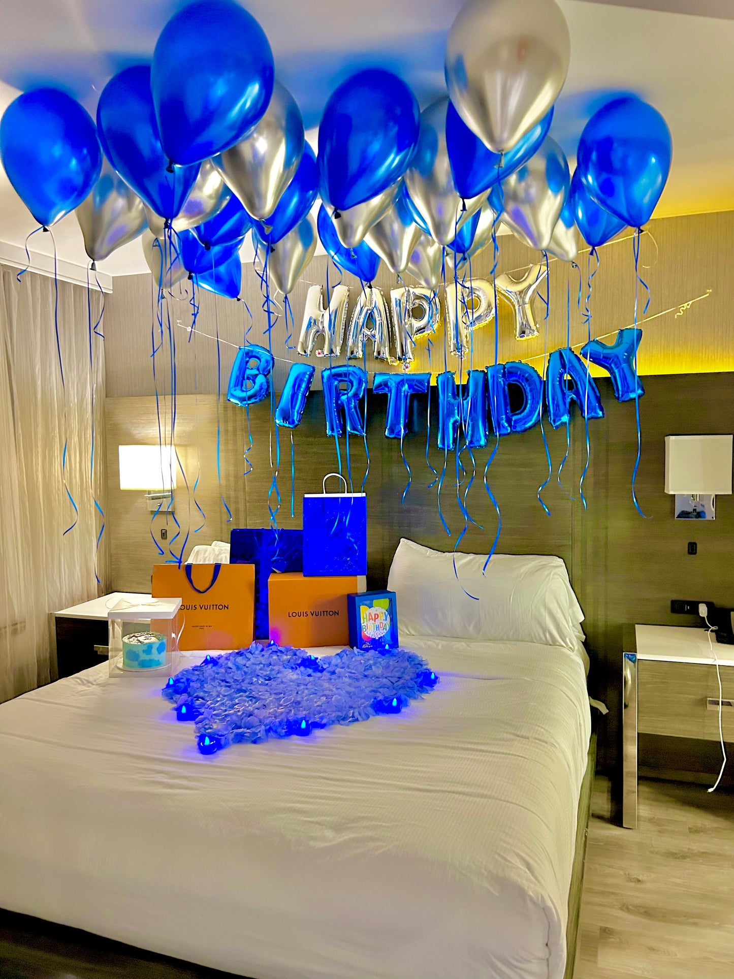 Blue & Silver Happy Birthday Balloon Decor with helium balloons, banner, and number stands.