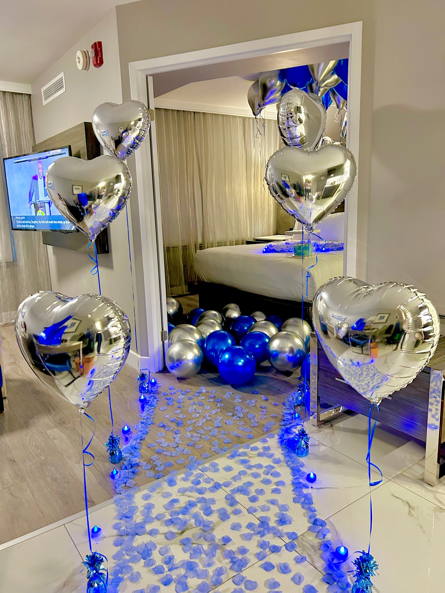 Blue & Silver Happy Birthday Balloon Decor with helium balloons, banner, and number stands.