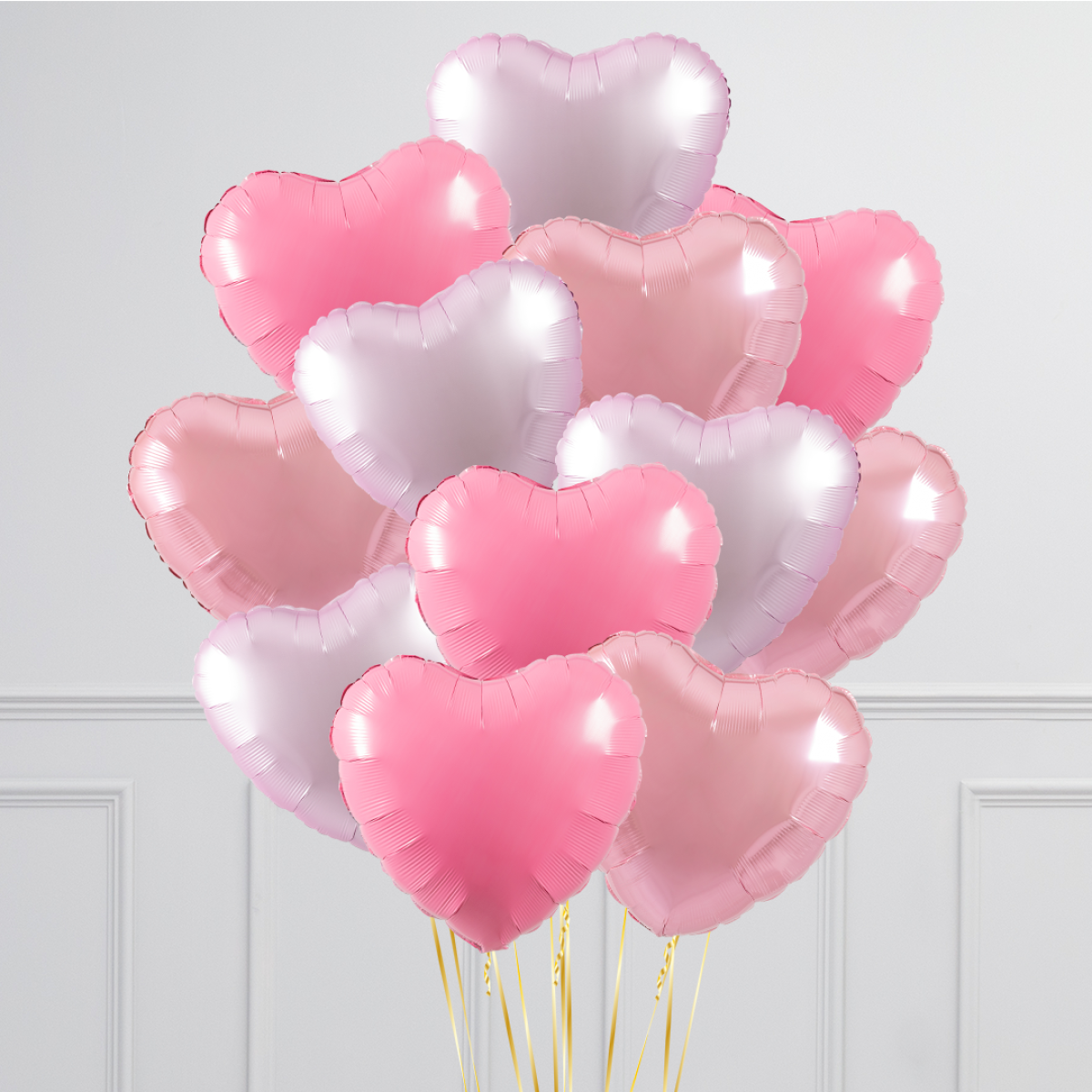 A bouquet of colorful 17-inch helium-filled heart balloons in various colors.