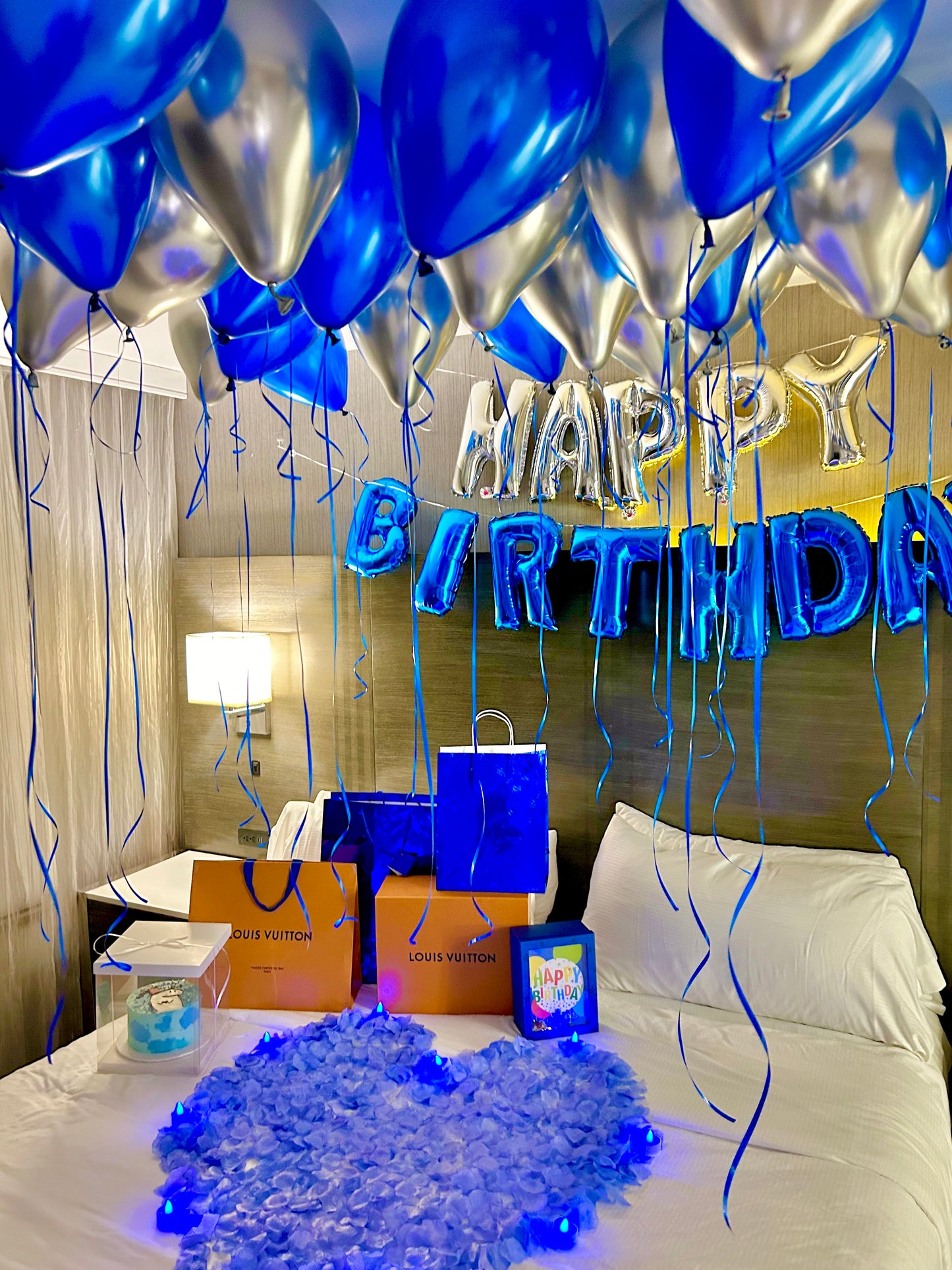Blue & Silver Happy Birthday Balloon Decor with helium balloons, banner, and number stands.