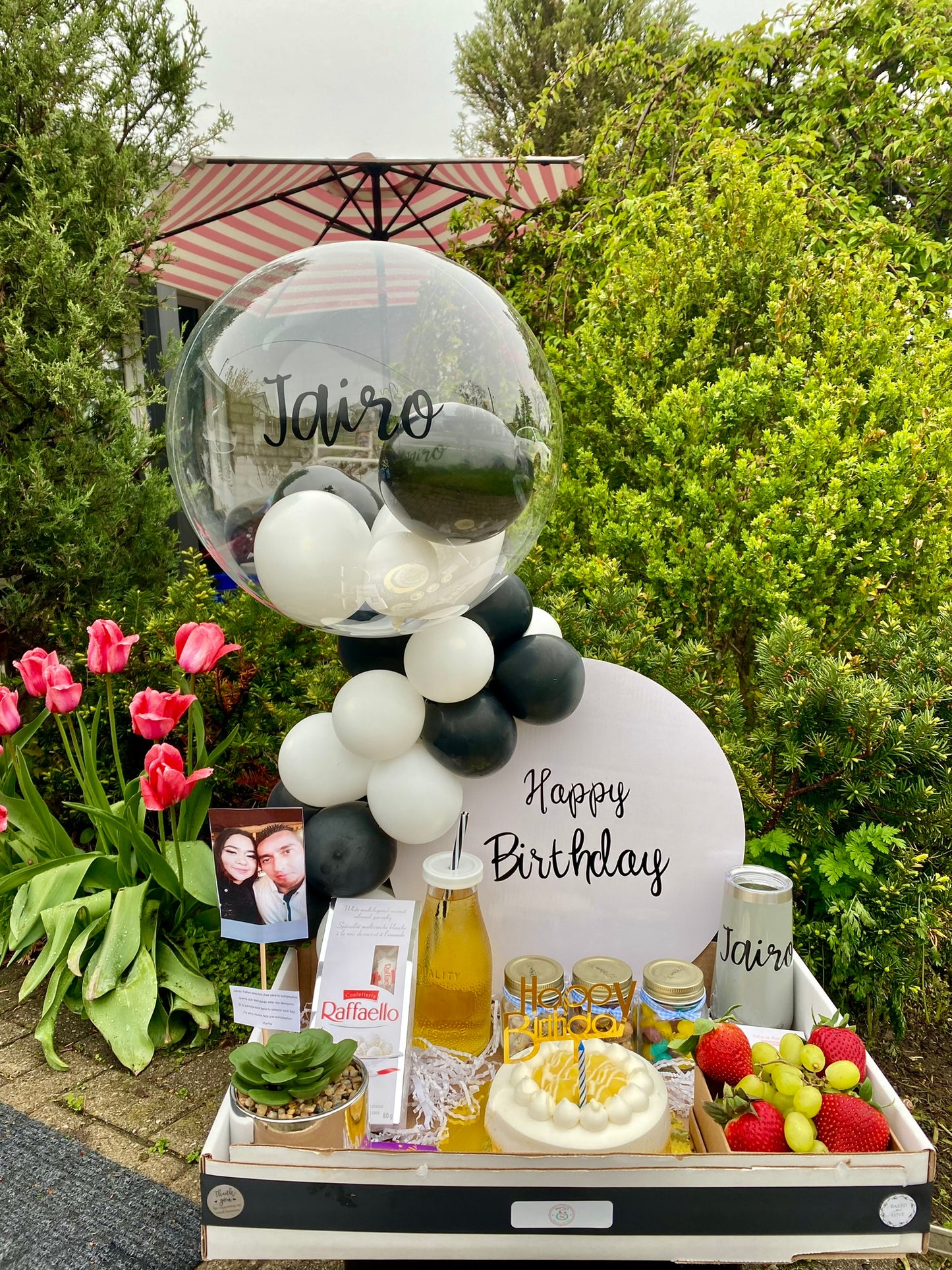 Breakfast Surprise Box filled with assorted pastries, fresh fruit, a cake, and customizable items to brighten the morning.