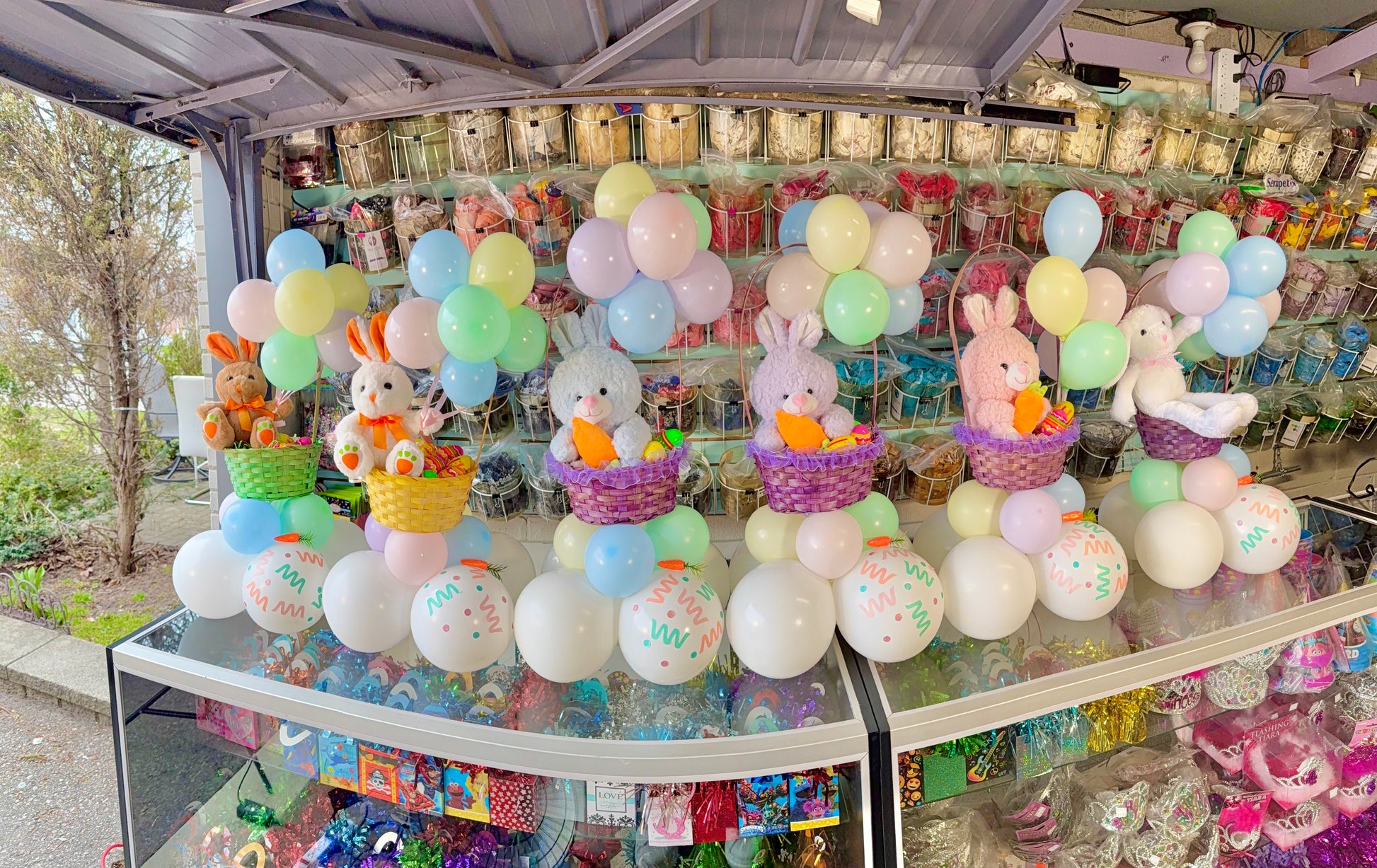 Display of Easter-themed balloons and decorations in a store.