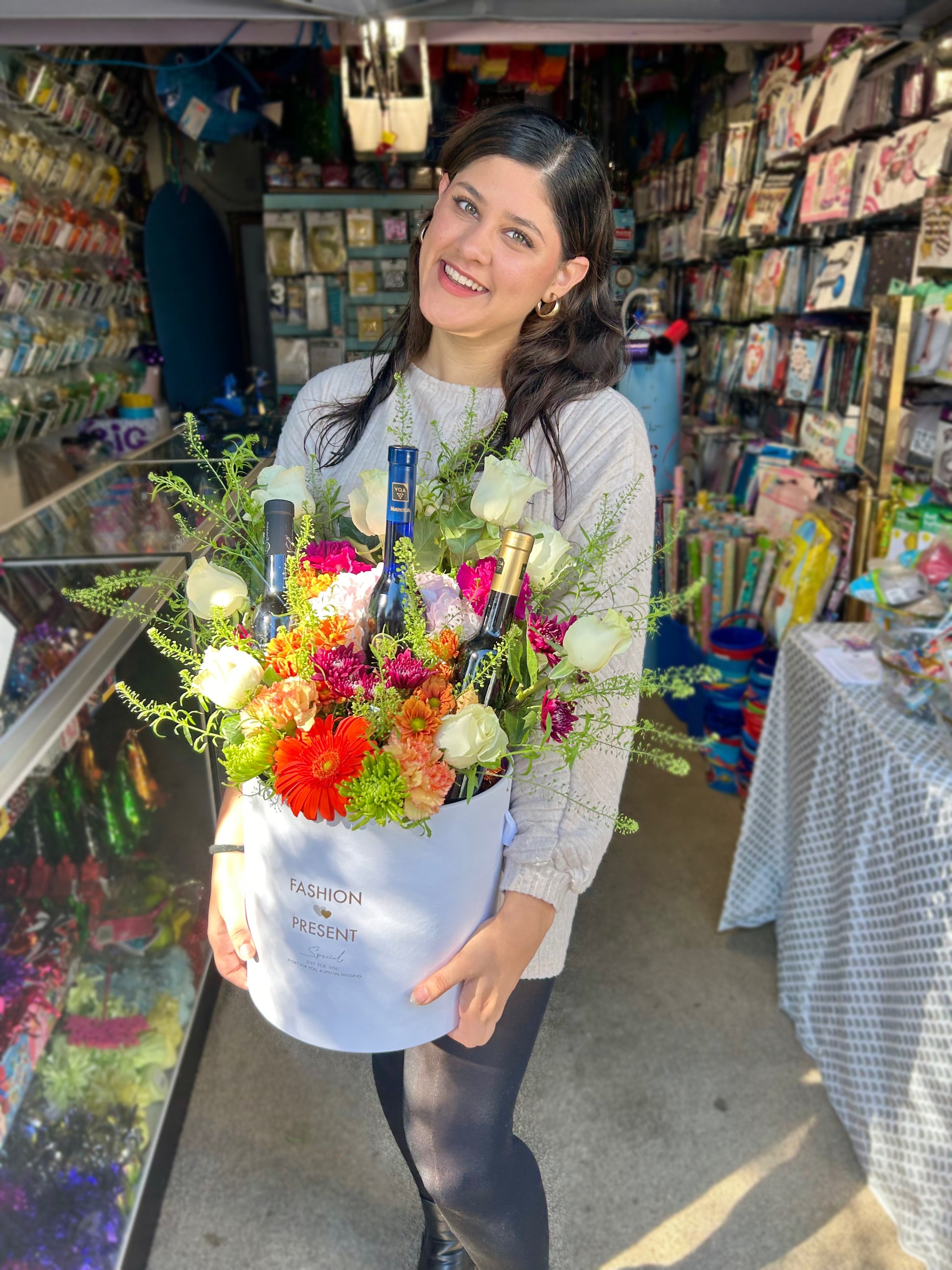 Luxury Floral & Wine Arrangement with 3 wine bottles and seasonal flowers in a stylish bucket