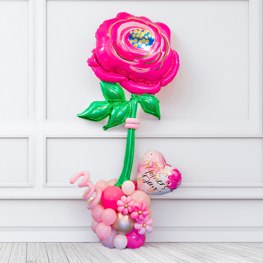 Mother's Day Giant Balloon Flower Stand. Giant pink flower balloon stand with heart balloon and latex balloons, helium-filled top and air-filled base