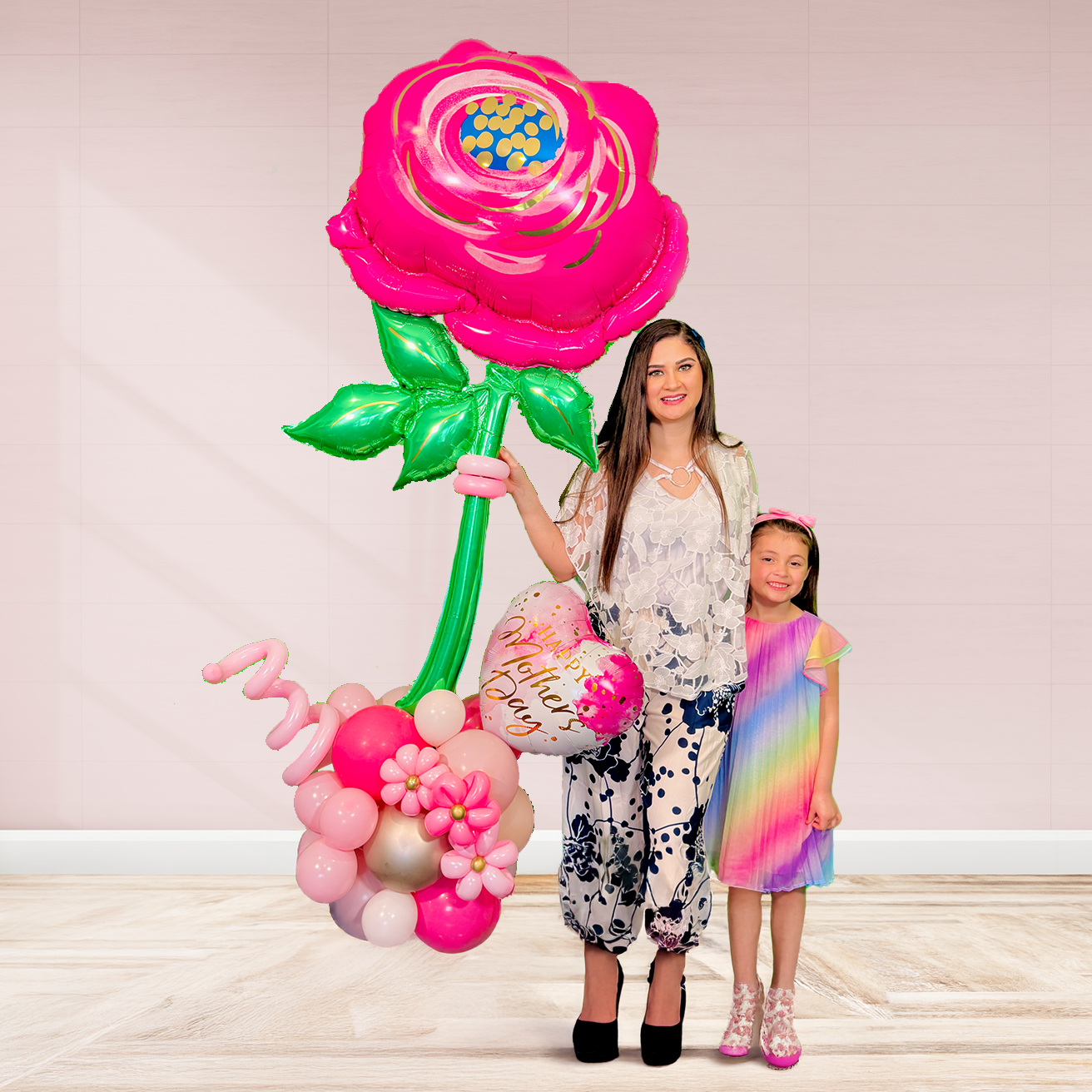 Giant pink flower balloon stand with heart balloon and latex balloons, helium-filled top and air-filled base