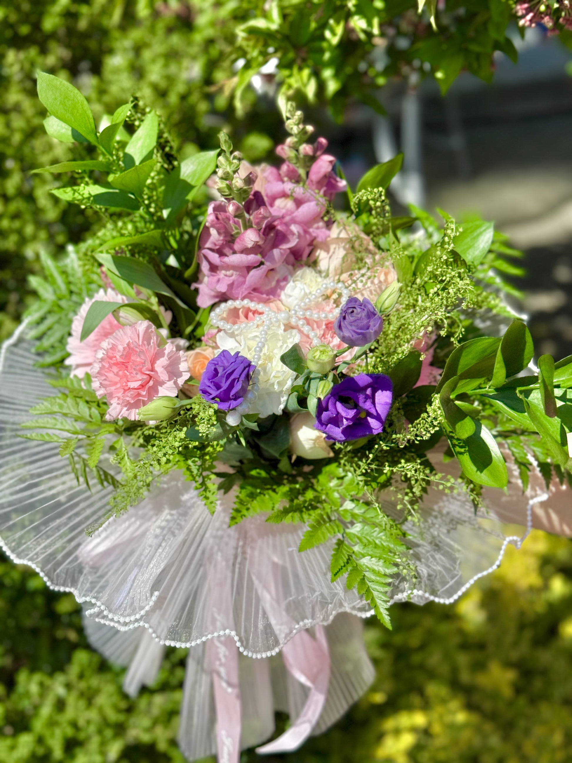Bouquet of flowers with pink, purple, and green colors made by wooow balloons Toronto.