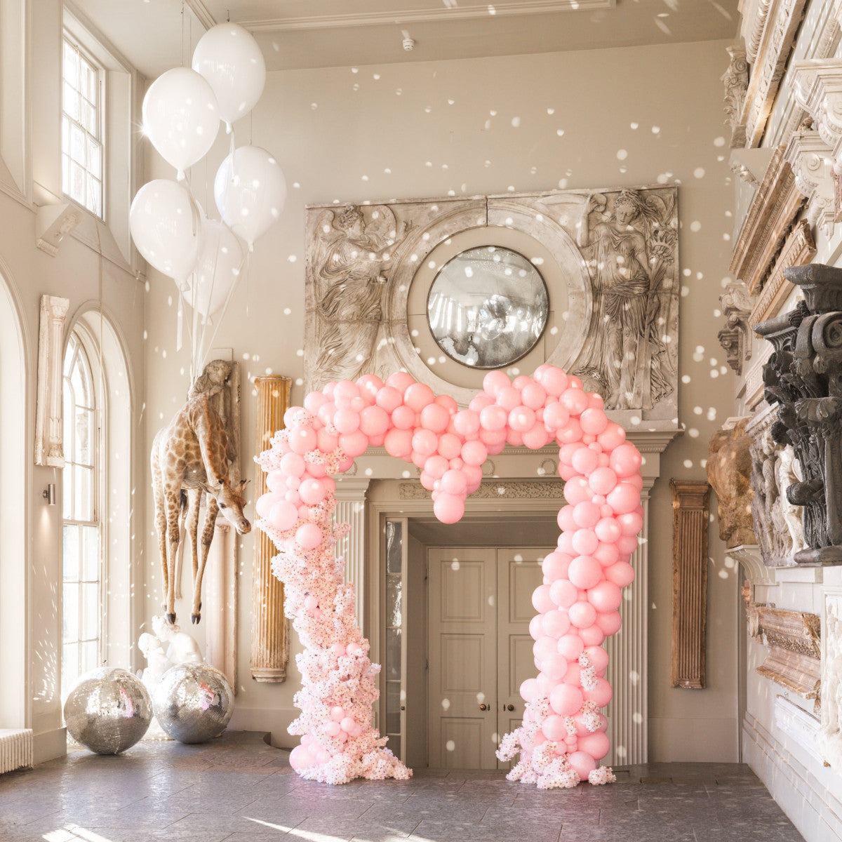 Customizable heart-shaped balloon arch in vibrant colors for weddings and celebrations.