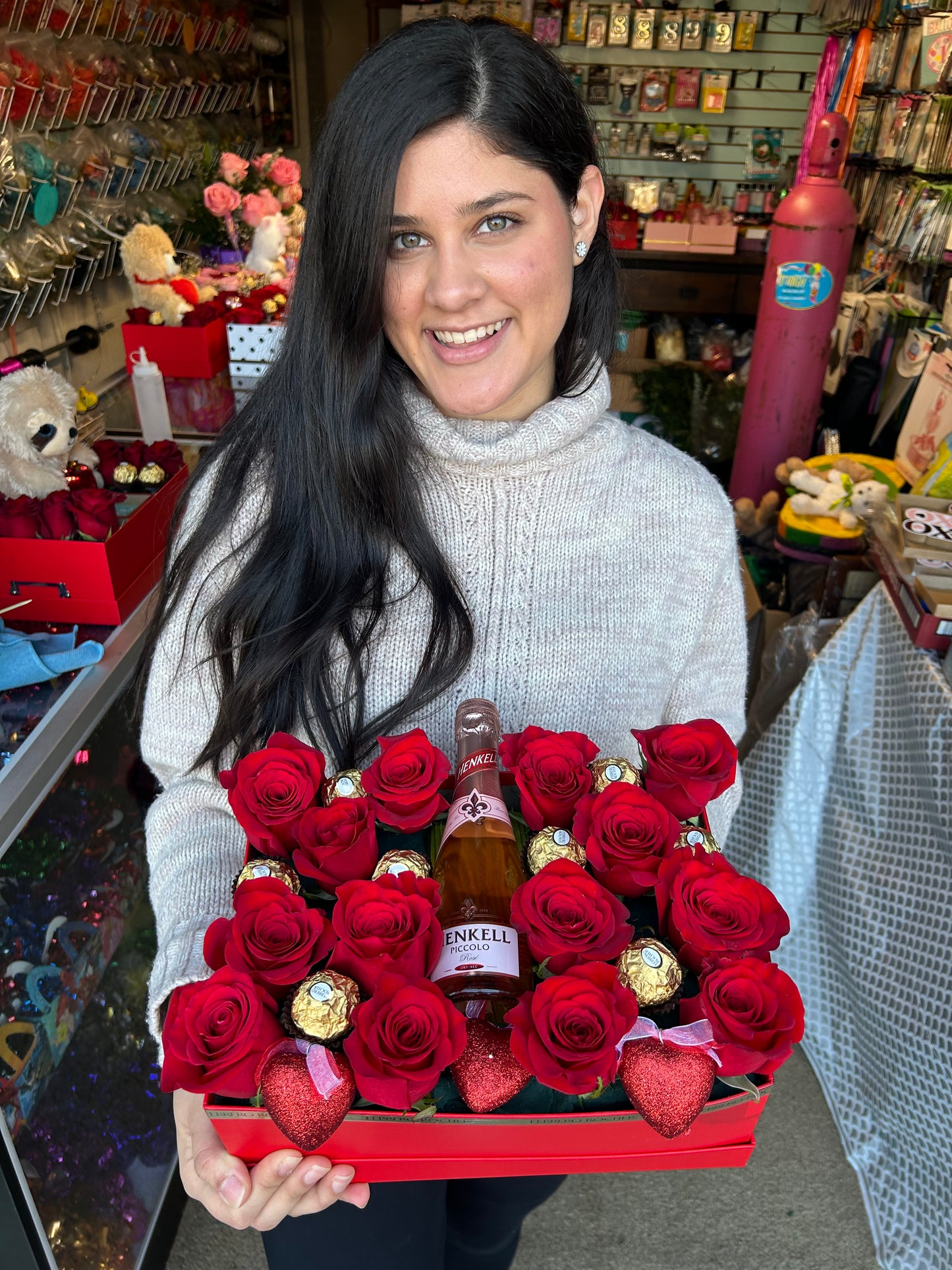 The Flower Box with fresh red roses, Ferrero Rocher chocolates, and a mini bottle for special occasions.