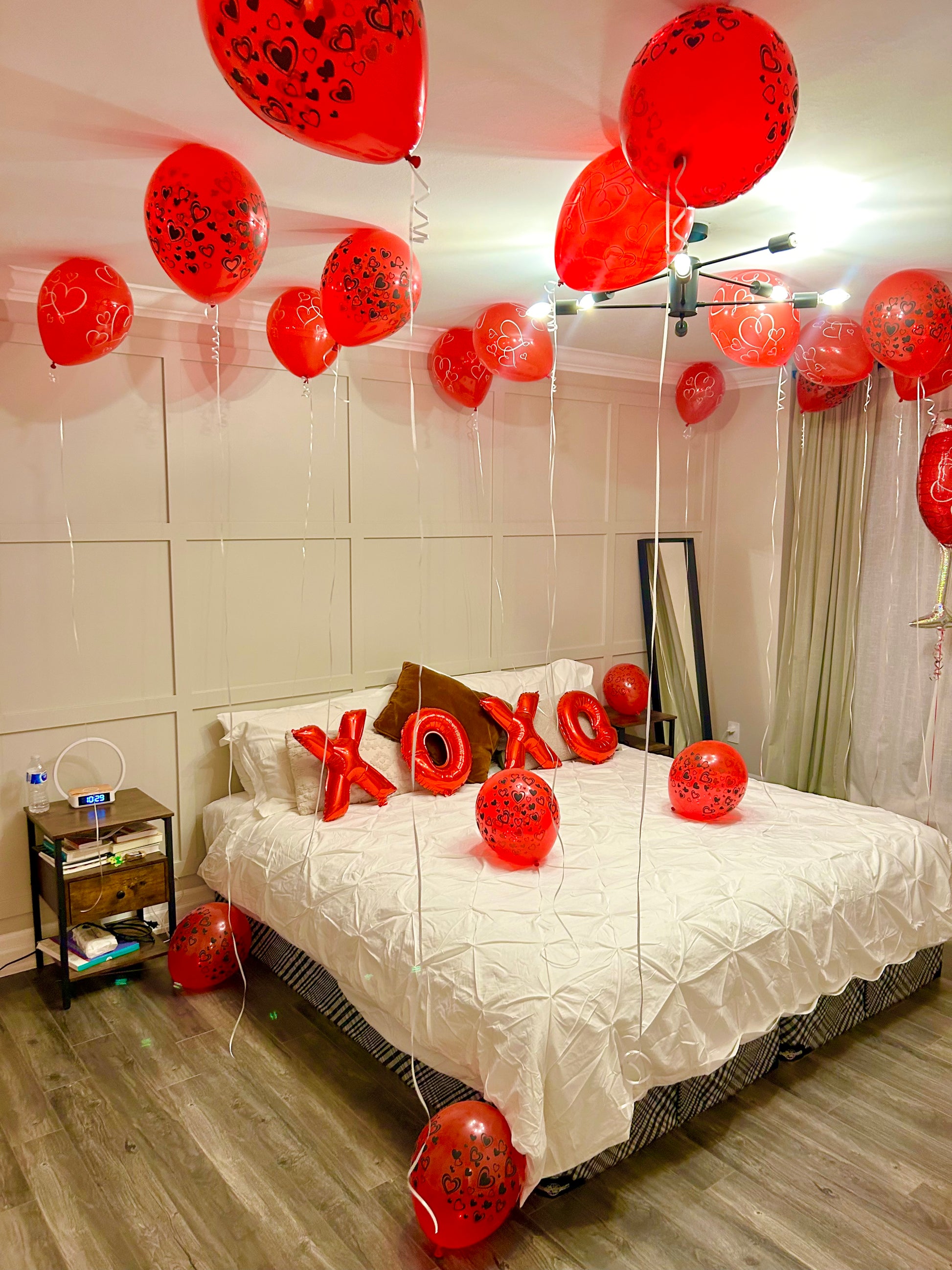 Romantic XOXO Balloon Room Decor with helium balloons and bed decoration