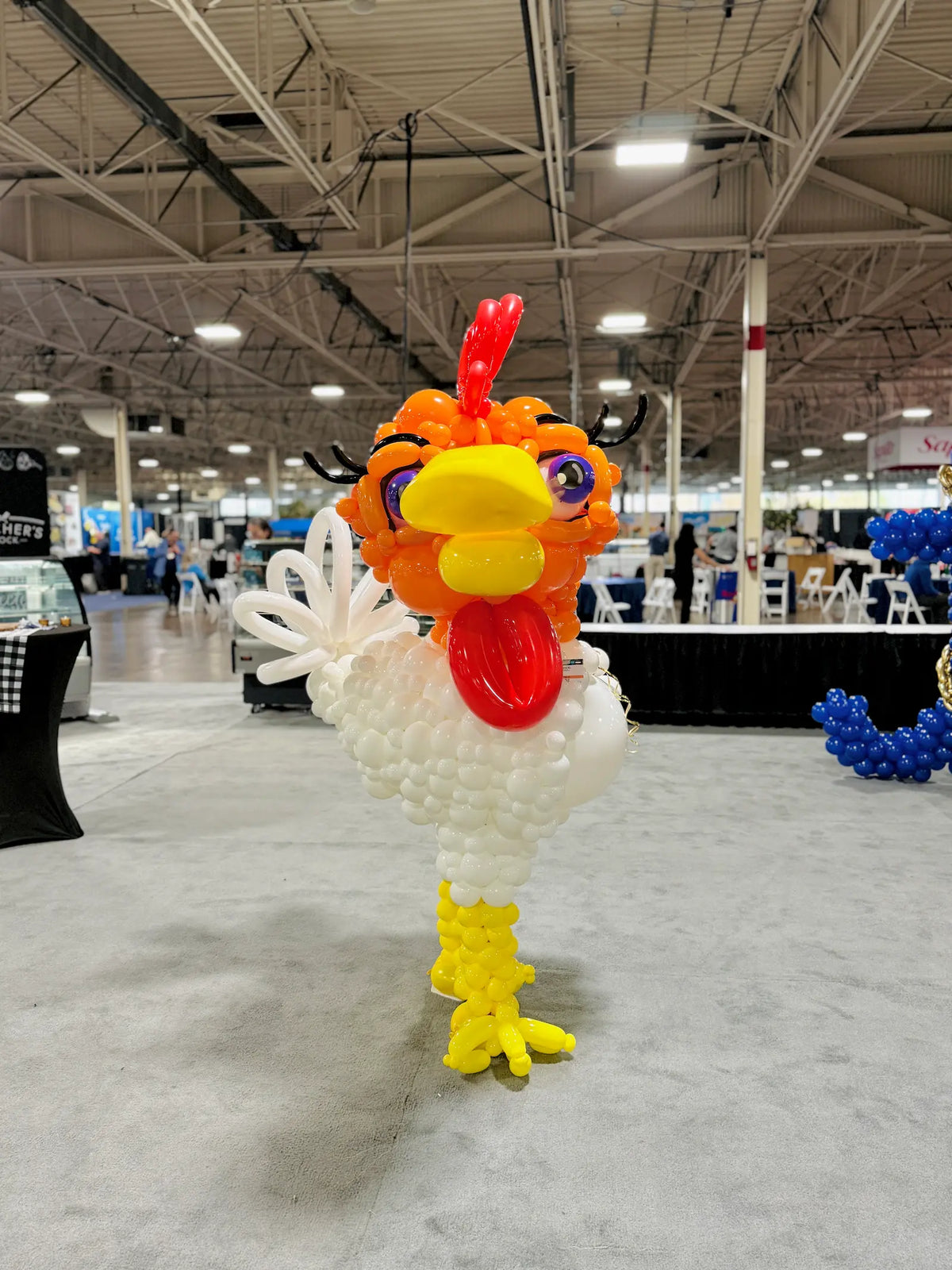 Handcrafted chicken balloon art installation for trade shows and corporate event decor in Toronto