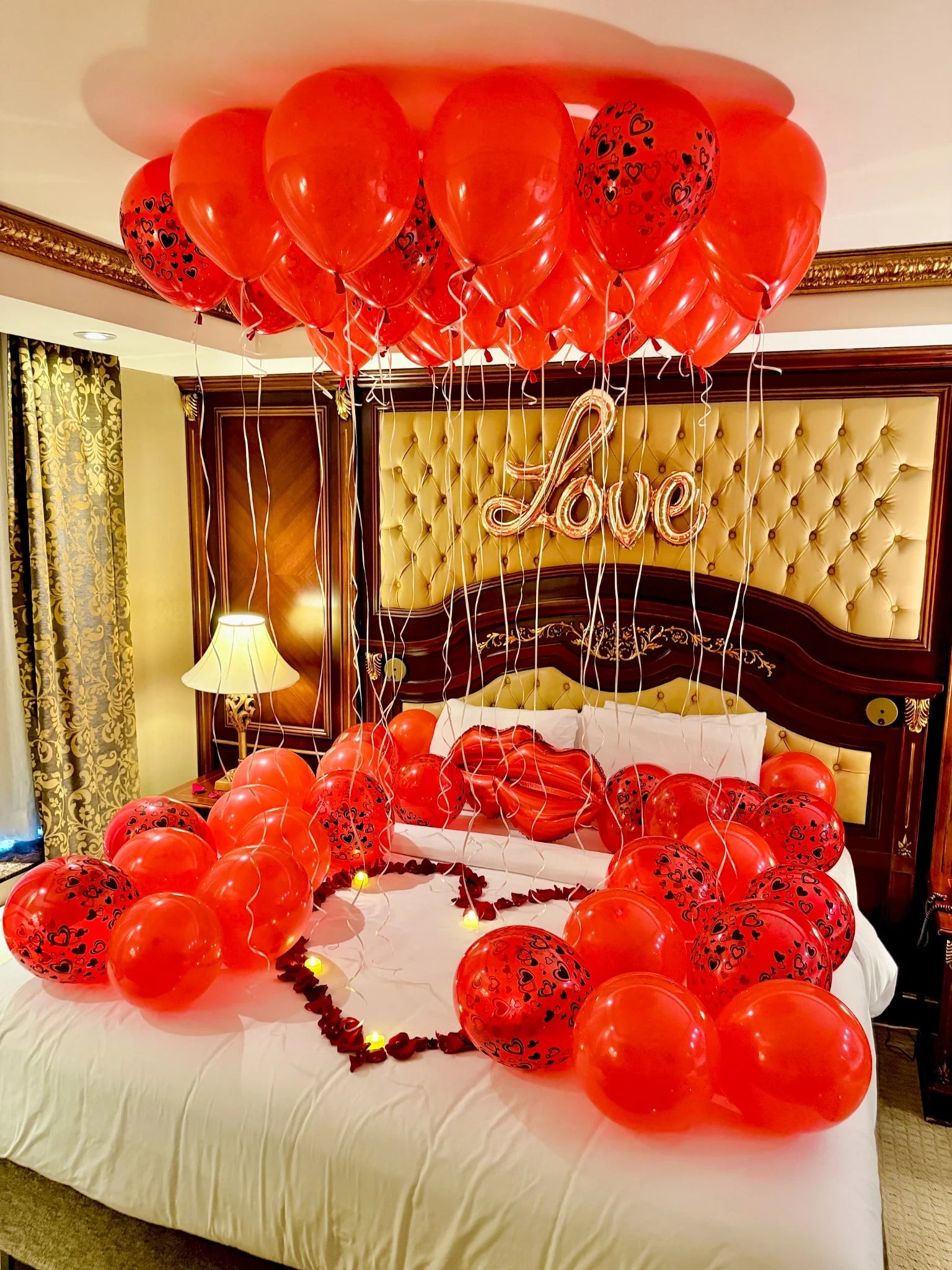 Luxury hotel decor with heart balloons and romantic lighting – couples’ surprise package in Toronto by Wooow Balloons