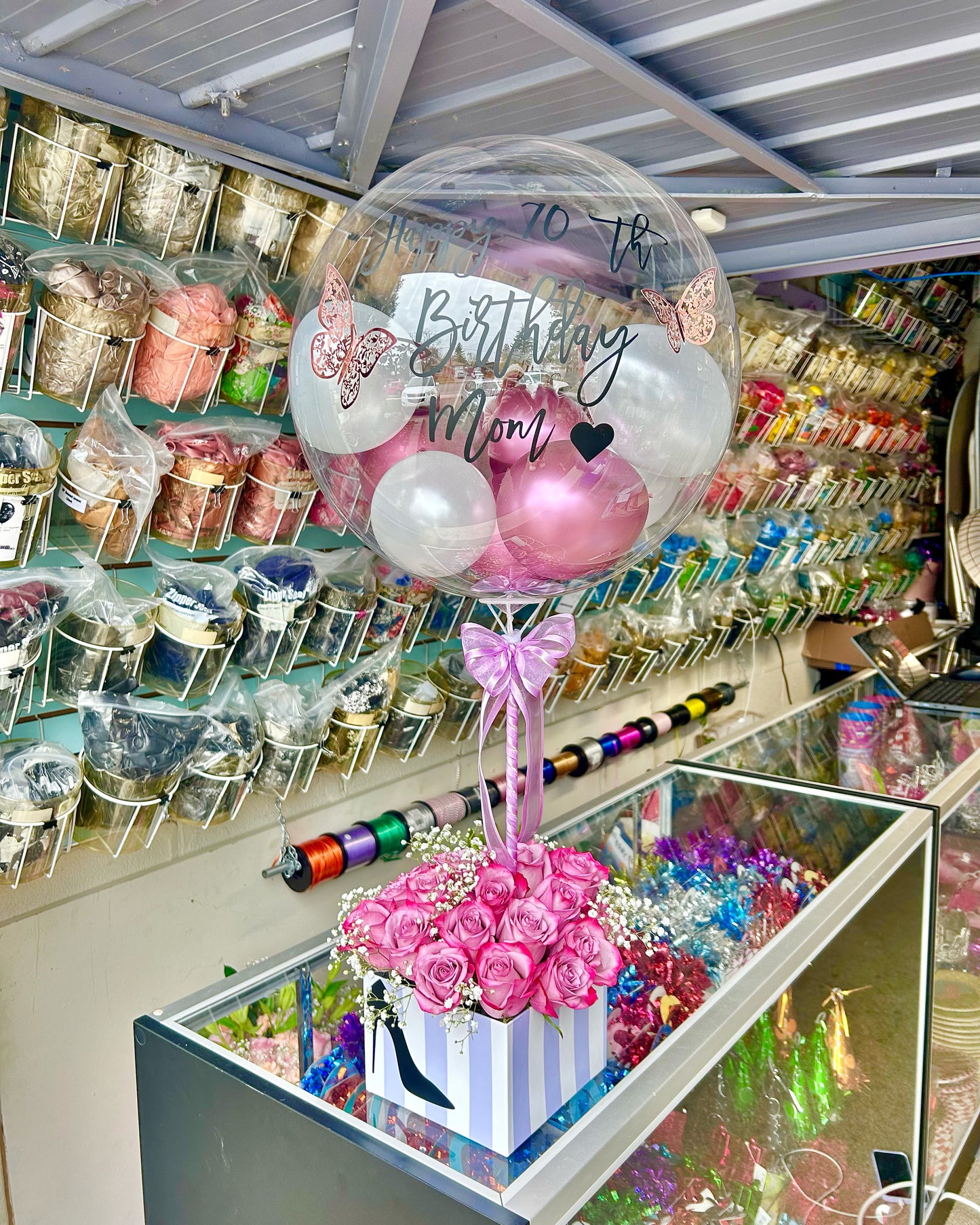 Personalized birthday balloon flower box Toronto – pink roses with clear bubble balloon and butterfly details by Wooow Balloons