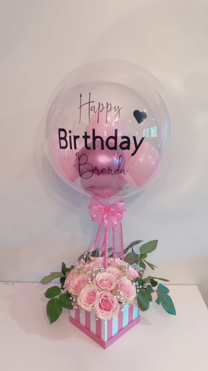 Elegant Rose Box with Bobo Balloon featuring 24 roses, greenery, and a personalized balloon on a decorated stick.