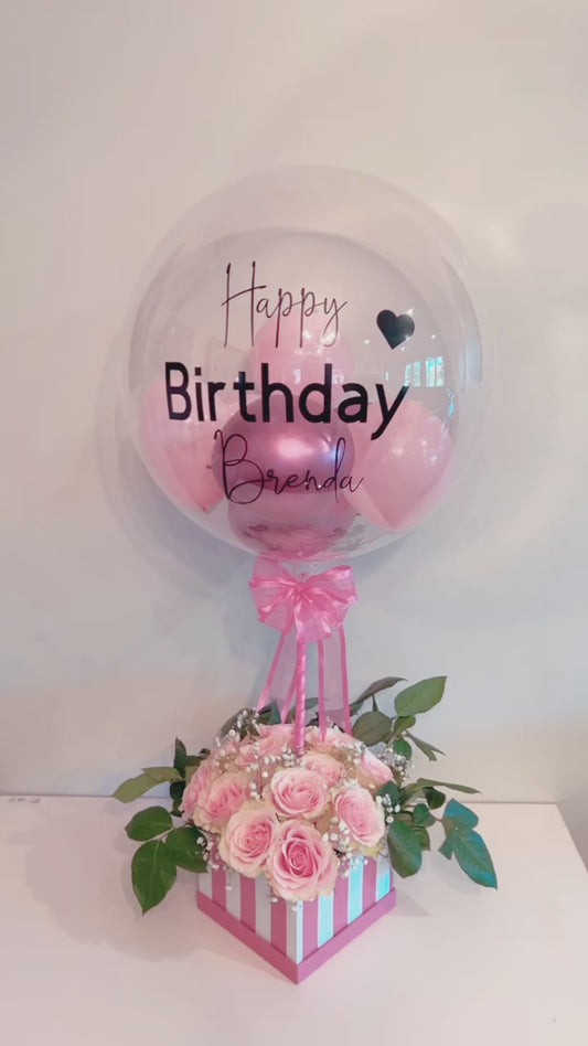 Elegant Rose Box with Bobo Balloon featuring 24 roses, greenery, and a personalized balloon on a decorated stick.