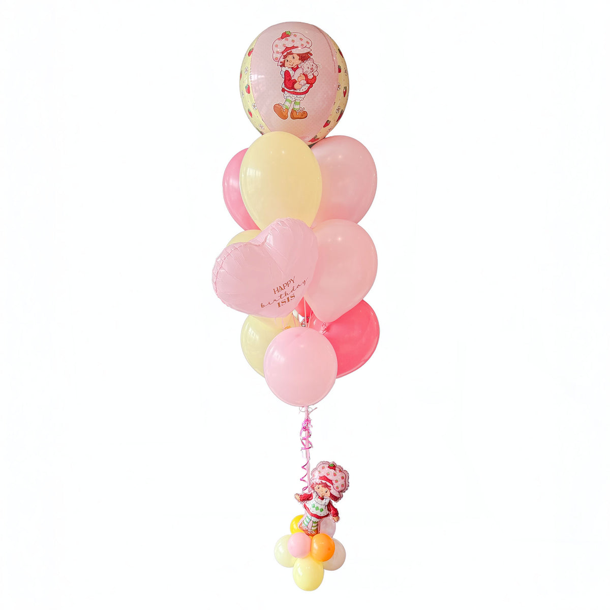 Strawberry Shortcake birthday balloon bouquet in Toronto with pink and yellow helium balloons, pink hearts and a character accent by Wooow Balloons