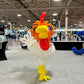 Balloon sculpture of a rooster in an indoor exhibition hall