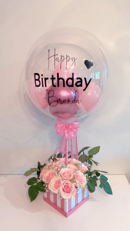 Elegant Rose Box with Bobo Balloon featuring 24 roses, greenery, and a personalized balloon on a decorated stick.