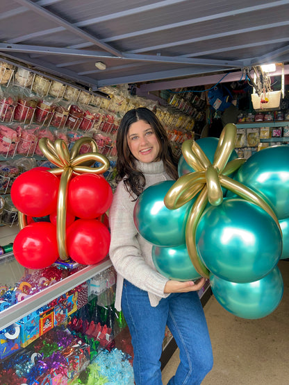 Freestanding air-filled Christmas balloon gifts with festive colors, made from biodegradable latex, lasting up to 10 days.
