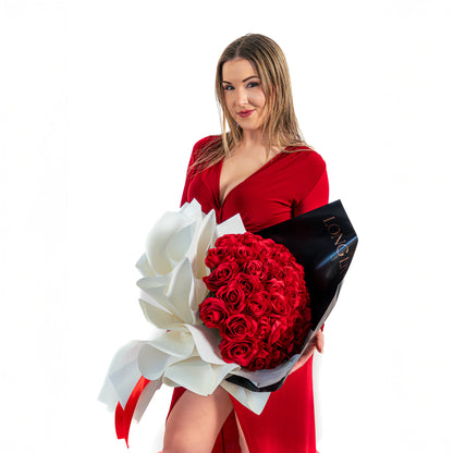 Model holding a 25 red roses bouquet in Toronto with luxury wrapping