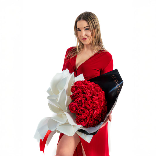 Model holding a 25 red roses bouquet in Toronto with luxury wrapping