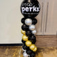 Balloon column with 'Sysco Perks! Premier Club' text against a plain wall.