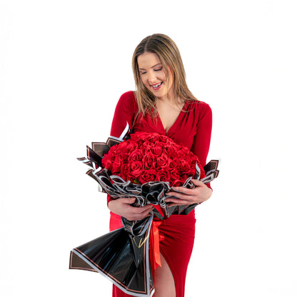 Red rose bouquet Toronto with elegant black wrapping and ribbon