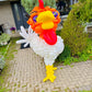 Balloon sculpture of a rooster in front of a house
