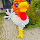 Balloon sculpture of a rooster on a patio