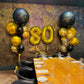 Decorated room with 'Happy Birthday Dad' balloons and a table set for a celebration.