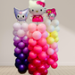 Colorful balloon display with cartoon character figures on a plain background