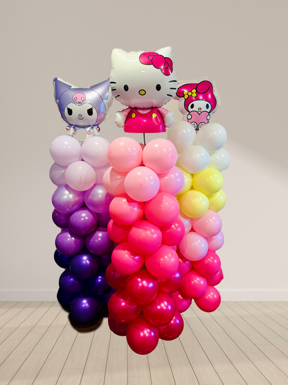 Colorful balloon display with cartoon character figures on a plain background