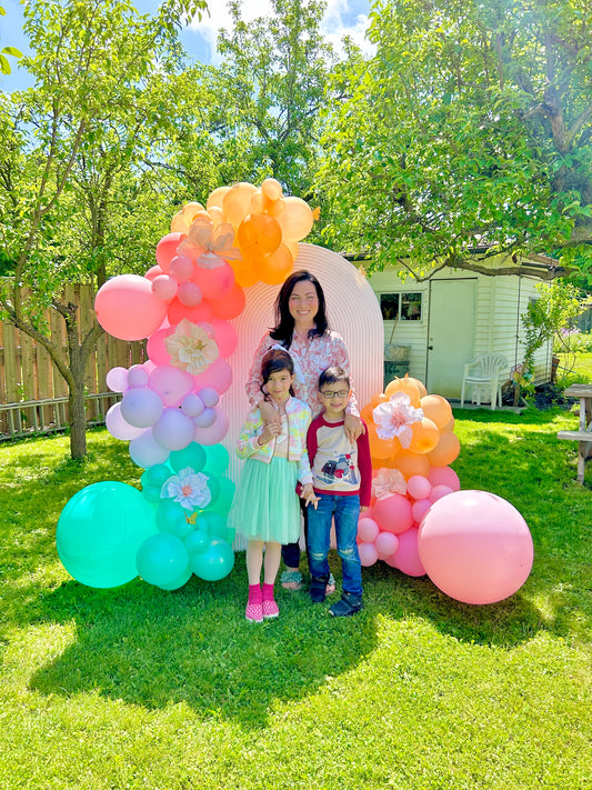 Spring Decor Setup with biodegradable balloon garlands and a festive backdrop.