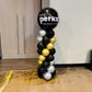 Balloon column with Sysco Perks logo in a room setting