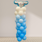 Balloon sculpture of a cartoon character with blue and white balloons on a plain background