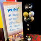 SYSCO perks promotional banner with balloons on a table