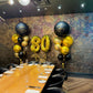 Decorated dining room with balloons for a 80th birthday celebration.