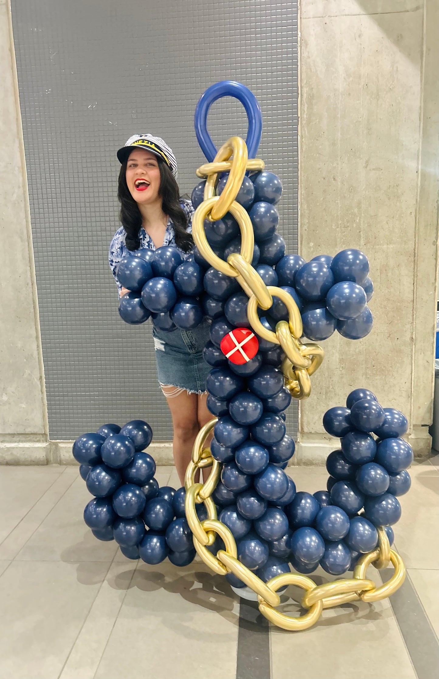 Freestanding Balloon Anchor Sculpture with navy, gold, and red biodegradable balloons.