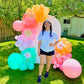 Spring Decor Setup with biodegradable balloon garlands and a festive backdrop.

