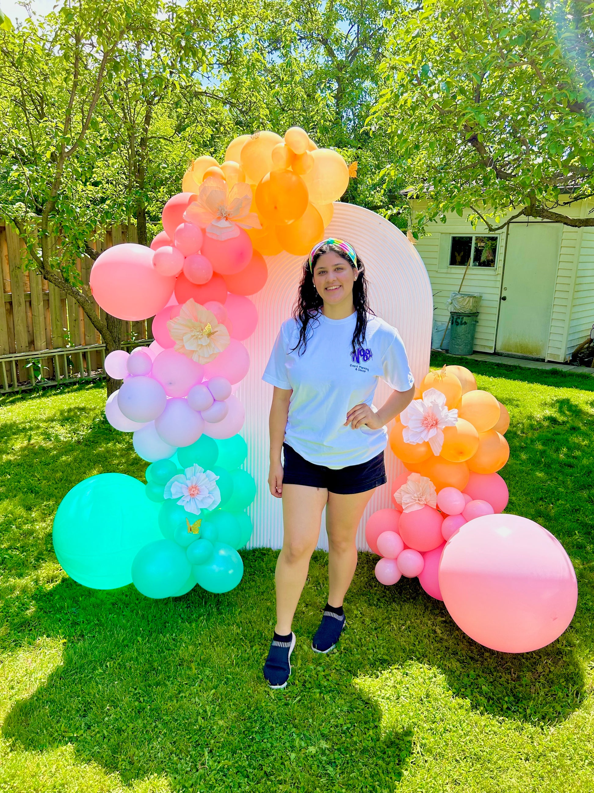 Spring Decor Setup with biodegradable balloon garlands and a festive backdrop.

