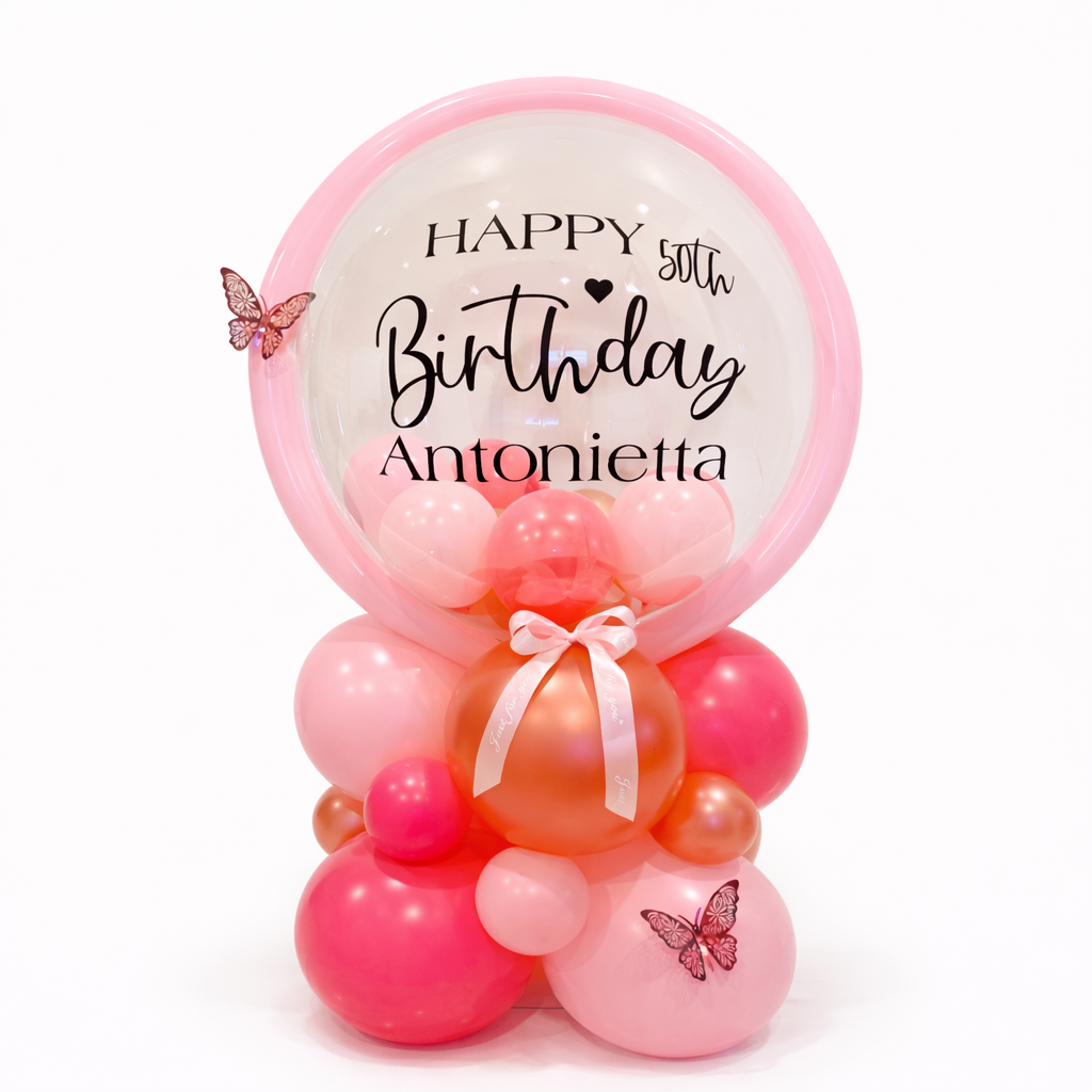 Balloon arrangement with 'Happy 50th Birthday Antonietta' text on a white background