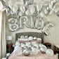 Bride WOW Decor with ceiling balloons, floor balloons, and "BRIDE" letter arch.