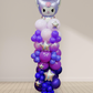 Balloon column with a character head and stars on a plain background