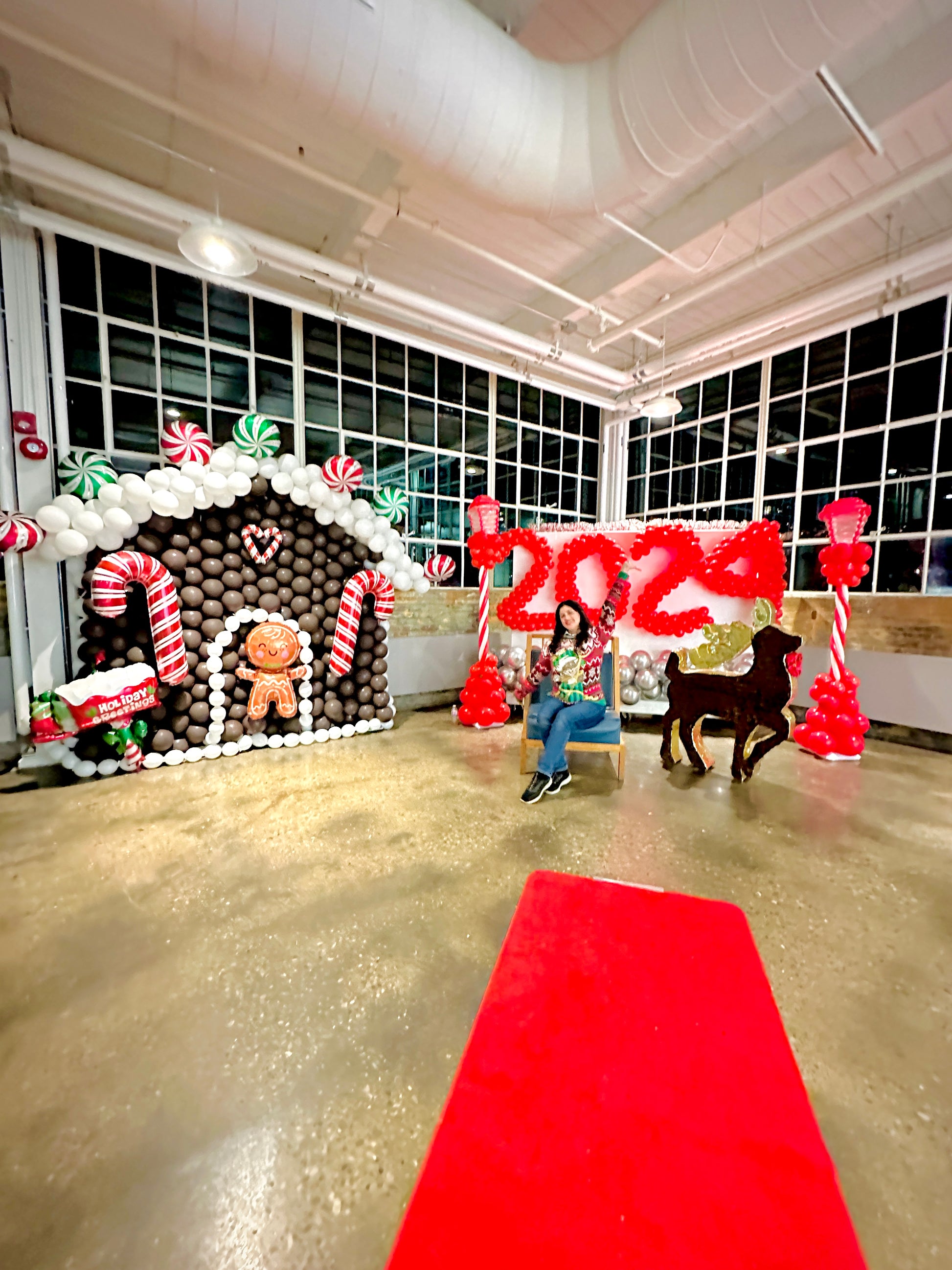 Gingerbread Balloon House with festive balloons and holiday decorations.