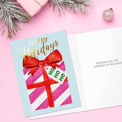 Christmas card with a red bow and gift box design on a pink background
