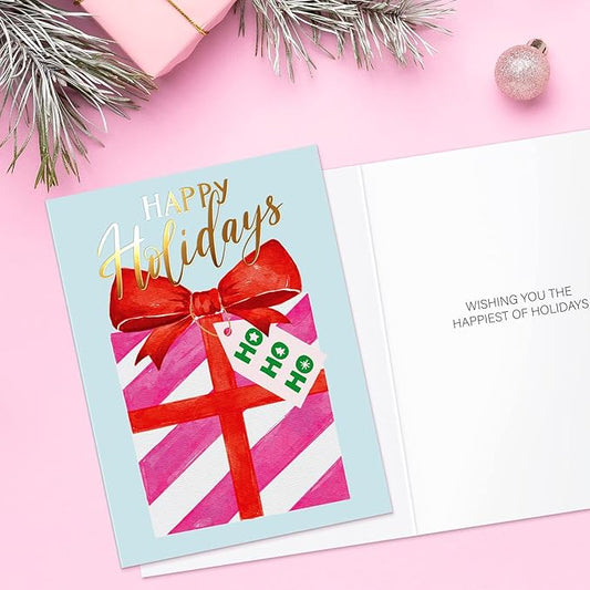 Christmas card with a red bow and gift box design on a pink background