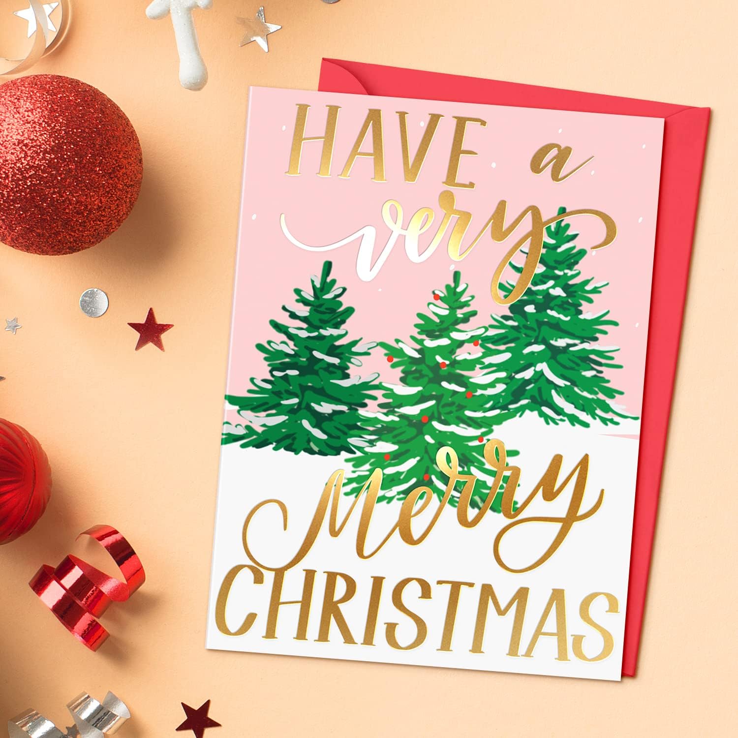 Christmas card with trees and text on a festive background
